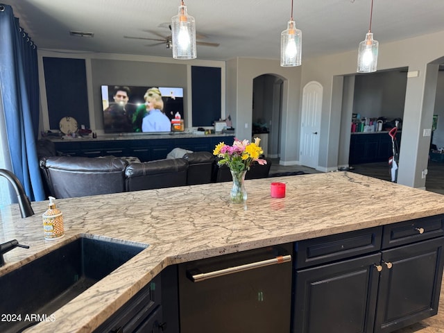 kitchen with pendant lighting, ceiling fan, dishwasher, and sink