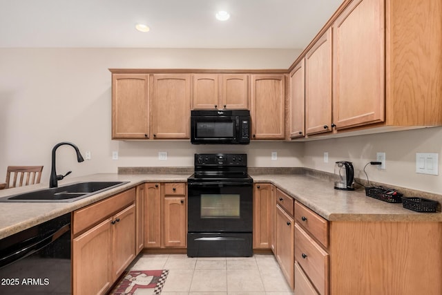 kitchen with sink, light brown cabinets, black appliances, and light tile patterned flooring