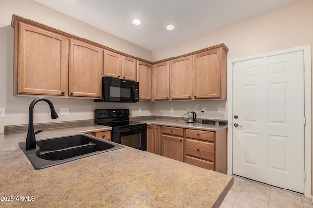 kitchen with black appliances, light brown cabinets, light tile patterned floors, and sink