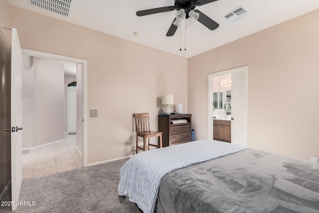 carpeted bedroom featuring ensuite bathroom and ceiling fan