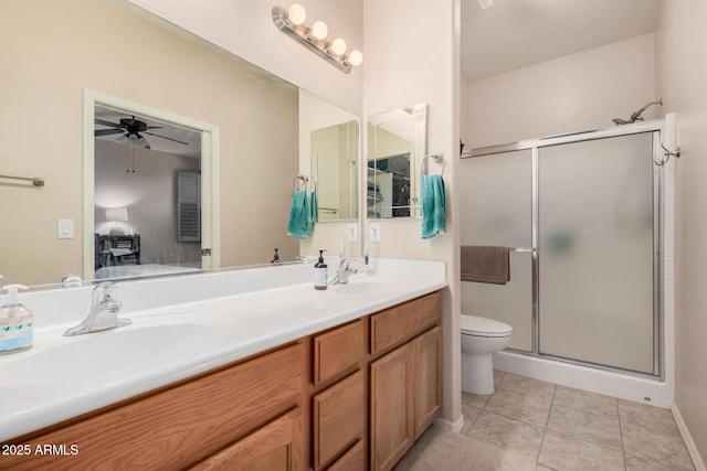 bathroom with an enclosed shower, tile patterned floors, vanity, toilet, and ceiling fan