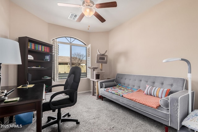 carpeted home office with ceiling fan