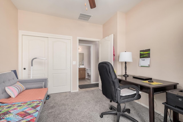 office space featuring ceiling fan and light carpet