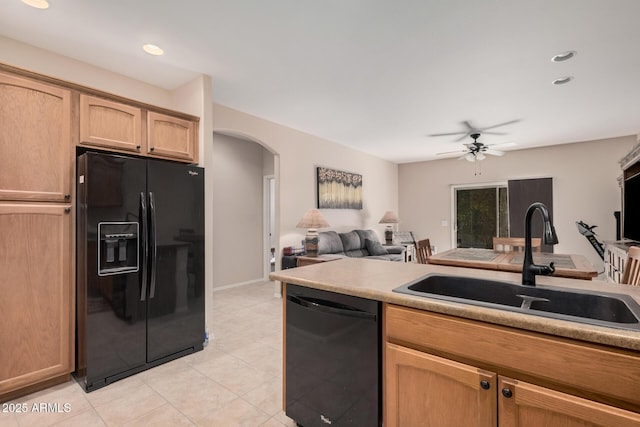 kitchen with light brown cabinets, ceiling fan, sink, light tile patterned floors, and black appliances