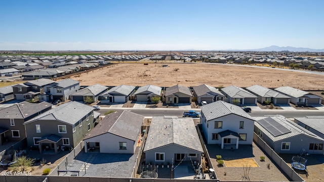 birds eye view of property with a mountain view and a residential view