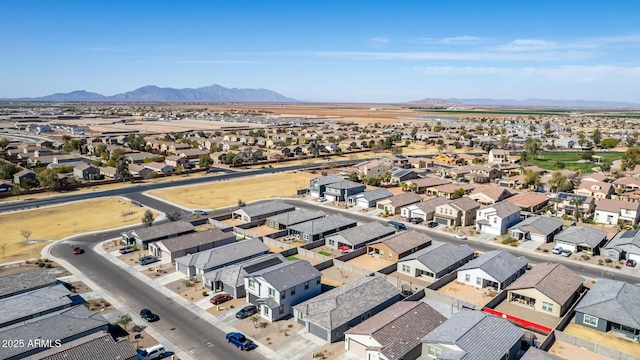 drone / aerial view featuring a residential view and a mountain view