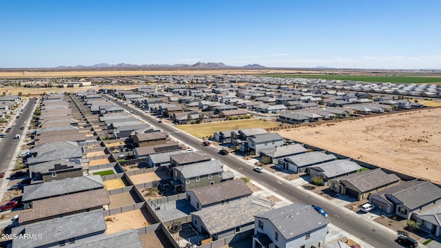 drone / aerial view featuring a residential view and a mountain view