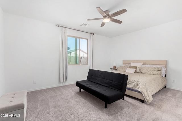 bedroom featuring baseboards, a ceiling fan, visible vents, and light colored carpet
