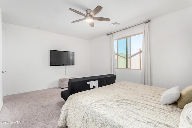bedroom featuring carpet floors, visible vents, and a ceiling fan