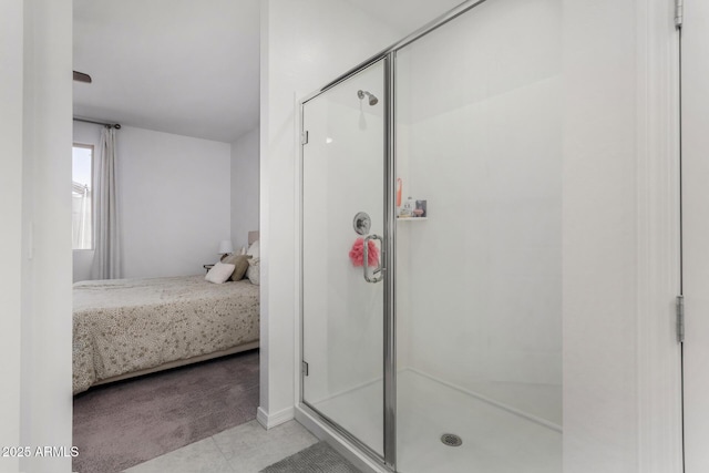 bathroom with connected bathroom and a shower stall
