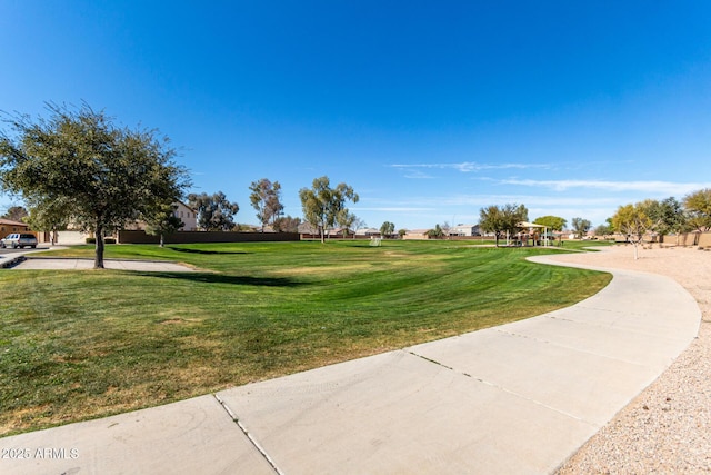 view of property's community featuring a yard