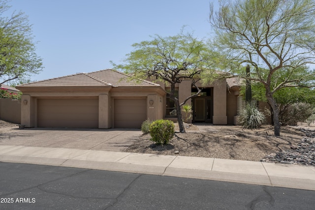 6917 E Night Glow Cir, Scottsdale, AZ 85266 - view of front of property with stucco siding, driveway, and an attached garage