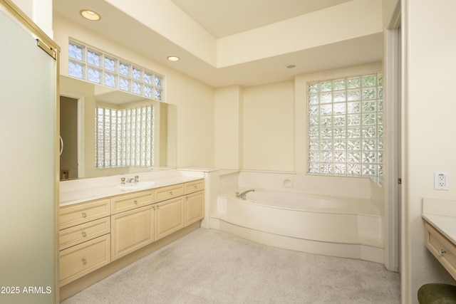 6917 E Night Glow Cir, Scottsdale, AZ 85266 - bathroom featuring vanity, a bath, recessed lighting, and carpet floors