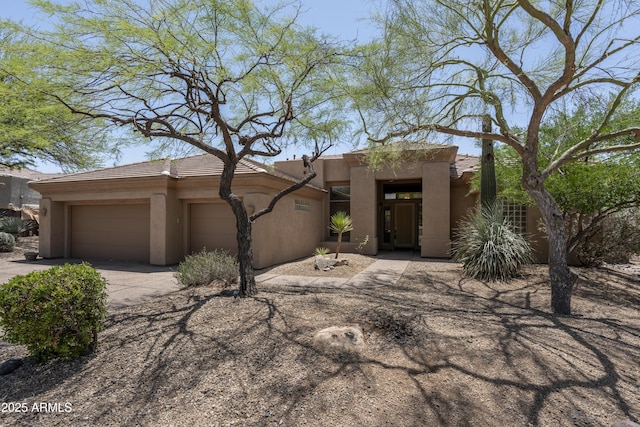 6917 E Night Glow Cir, Scottsdale, AZ 85266 - southwest-style home featuring driveway, a garage, stucco siding, and a tiled roof