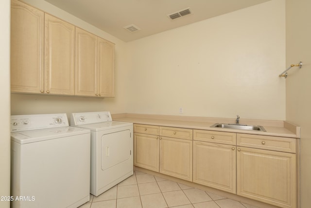 6917 E Night Glow Cir, Scottsdale, AZ 85266 - washroom featuring cabinet space, independent washer and dryer, and light tile patterned floors