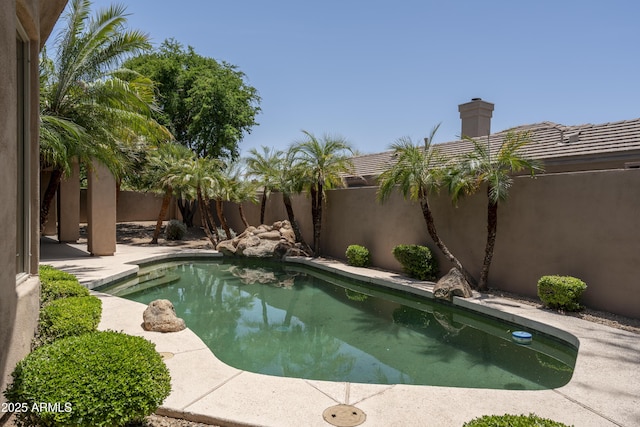 6917 E Night Glow Cir, Scottsdale, AZ 85266 - view of swimming pool with a fenced backyard