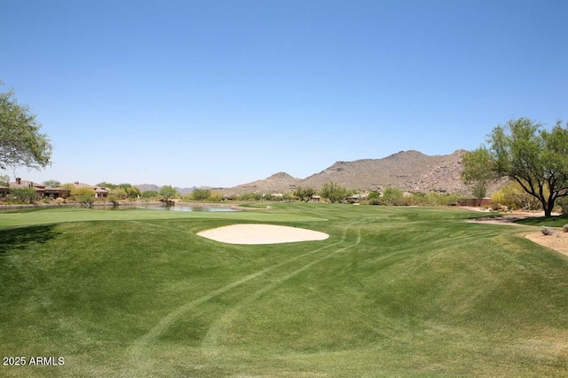 6917 E Night Glow Cir, Scottsdale, AZ 85266 - view of home's community with view of golf course, a water and mountain view, and a yard