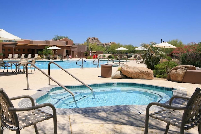 6917 E Night Glow Cir, Scottsdale, AZ 85266 - community pool featuring a patio area
