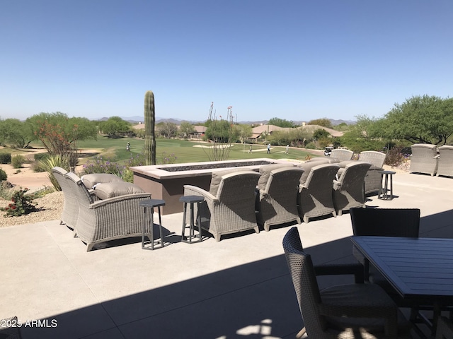 6917 E Night Glow Cir, Scottsdale, AZ 85266 - view of patio with view of golf course, outdoor dining space, a mountain view, and outdoor lounge area
