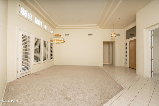 6917 E Night Glow Cir, Scottsdale, AZ 85266 - unfurnished room with a chandelier, light tile patterned flooring, and a towering ceiling