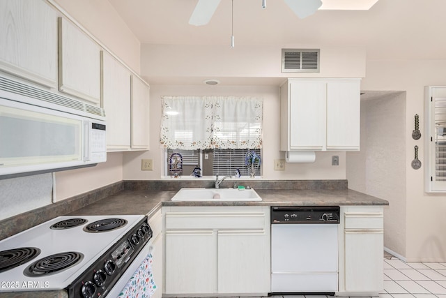 kitchen with visible vents, white cabinets, white appliances, a ceiling fan, and a sink