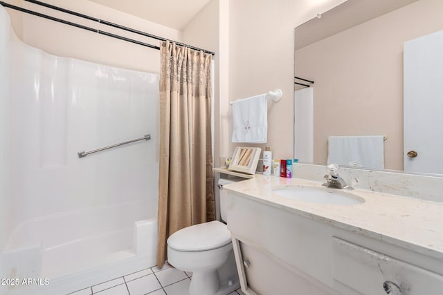 bathroom featuring vanity, tile patterned floors, and toilet