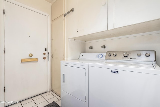 laundry room with light tile patterned flooring, laundry area, and washer and dryer