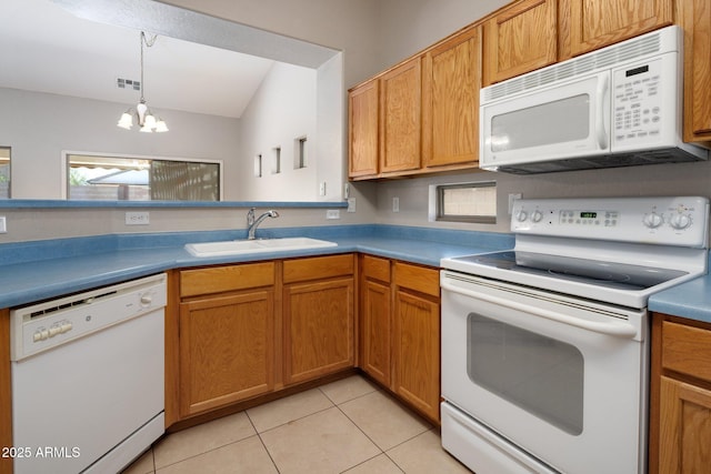 2615 W Silver Streak Way, San Tan Valley, AZ 85144 - kitchen with white appliances, a sink, a chandelier, light tile patterned flooring, and hanging light fixtures