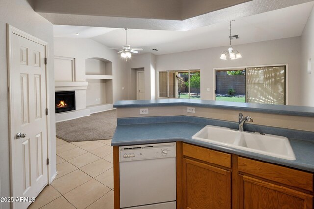 2615 W Silver Streak Way, San Tan Valley, AZ 85144 - kitchen featuring dishwasher, a sink, built in shelves, light tile patterned floors, and decorative light fixtures