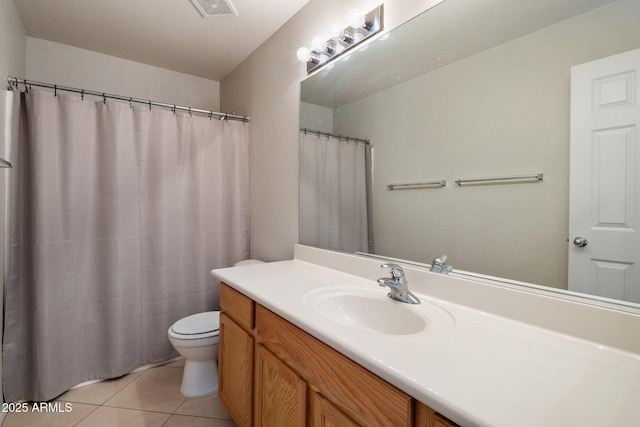 2615 W Silver Streak Way, San Tan Valley, AZ 85144 - bathroom with tile patterned flooring, toilet, and vanity