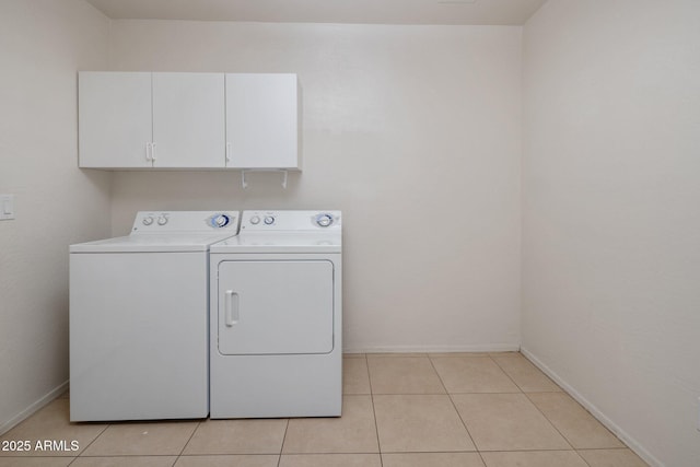 2615 W Silver Streak Way, San Tan Valley, AZ 85144 - clothes washing area featuring independent washer and dryer, cabinet space, light tile patterned flooring, and baseboards