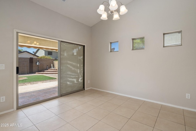 2615 W Silver Streak Way, San Tan Valley, AZ 85144 - unfurnished room with a chandelier, baseboards, lofted ceiling, and tile patterned floors
