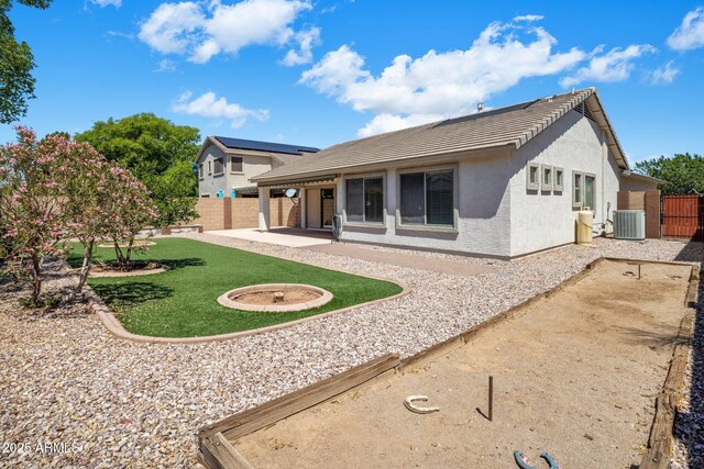 2615 W Silver Streak Way, San Tan Valley, AZ 85144 - rear view of property with a patio area, a tile roof, stucco siding, a gate, and central air condition unit