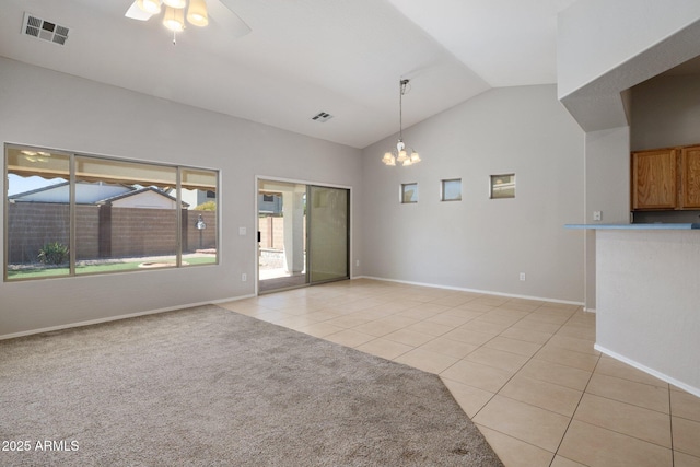 2615 W Silver Streak Way, San Tan Valley, AZ 85144 - unfurnished living room with light tile patterned floors, lofted ceiling, a chandelier, a ceiling fan, and baseboards