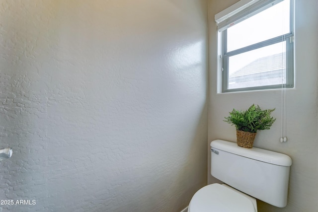 bathroom featuring toilet