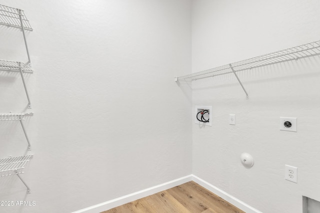 9261 W Sheridan St, Phoenix, AZ 85037 - laundry room featuring electric dryer hookup, washer hookup, light wood-type flooring, and gas dryer hookup