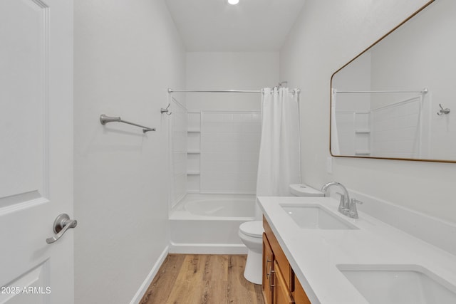 9261 W Sheridan St, Phoenix, AZ 85037 - full bath with double vanity, wood finished floors, and shower / tub combo
