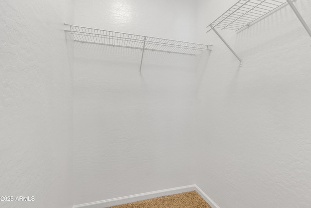 9261 W Sheridan St, Phoenix, AZ 85037 - spacious closet featuring light carpet