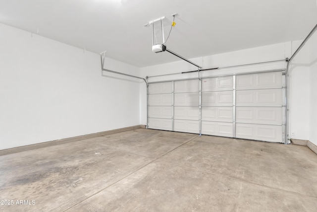 9261 W Sheridan St, Phoenix, AZ 85037 - garage featuring a garage door opener and baseboards