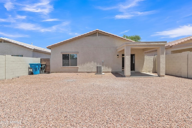 9261 W Sheridan St, Phoenix, AZ 85037 - rear view of house featuring stucco siding and a patio area