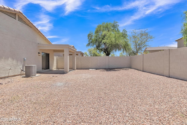 9261 W Sheridan St, Phoenix, AZ 85037 - fenced backyard featuring a patio