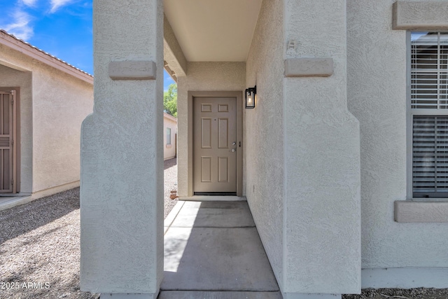 9261 W Sheridan St, Phoenix, AZ 85037 - doorway to property with stucco siding