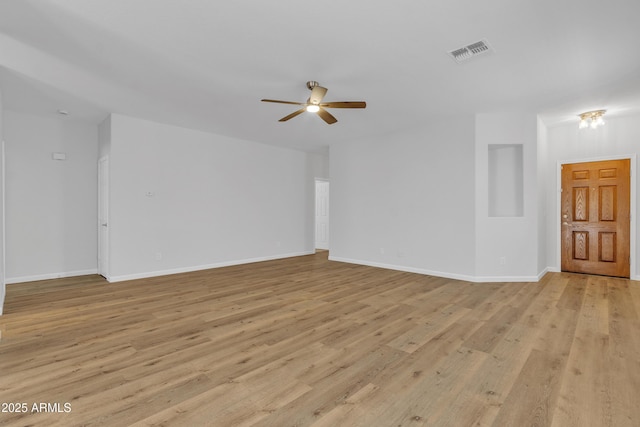 9261 W Sheridan St, Phoenix, AZ 85037 - unfurnished living room featuring ceiling fan and light wood-style flooring