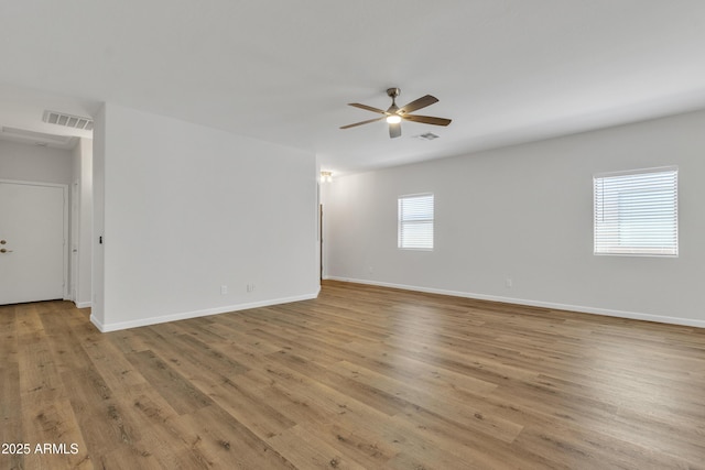 9261 W Sheridan St, Phoenix, AZ 85037 - unfurnished room featuring a ceiling fan and light wood finished floors