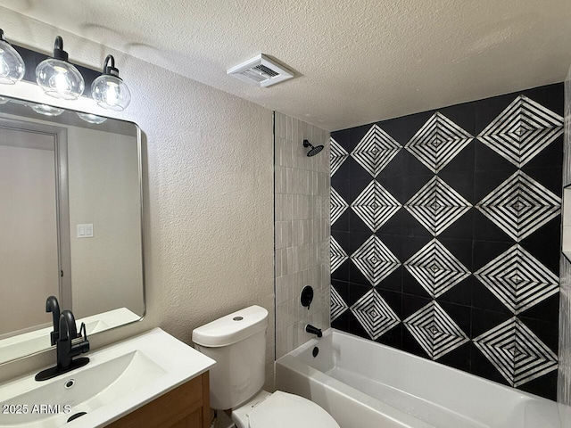 full bath with a textured wall, a textured ceiling, toilet, vanity, and bathing tub / shower combination
