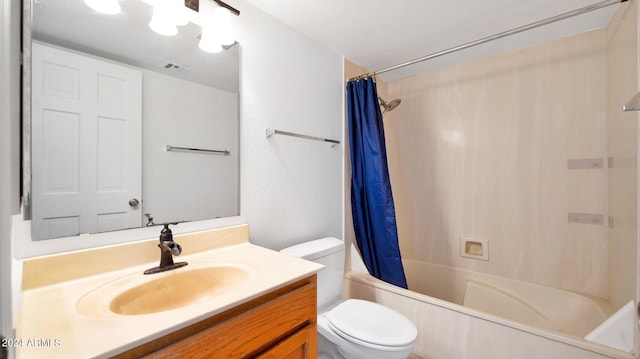 full bathroom featuring toilet, shower / tub combo with curtain, and vanity