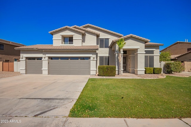 view of front facade with concrete driveway, a tiled roof, a front lawn, and stucco siding