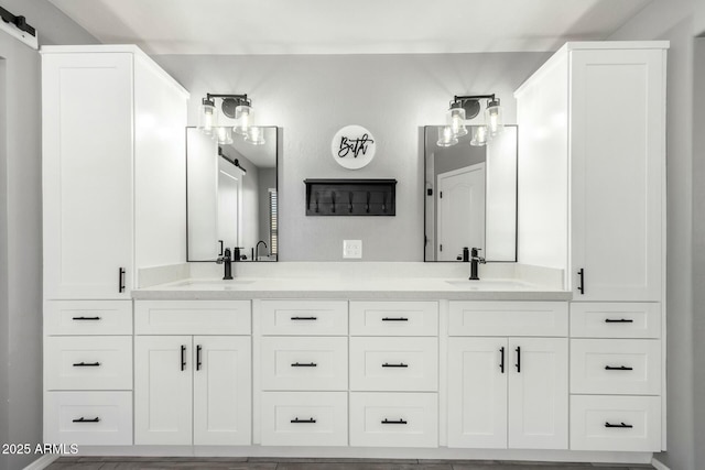 bathroom with a sink and double vanity