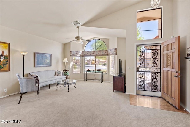 interior space with high vaulted ceiling and ceiling fan