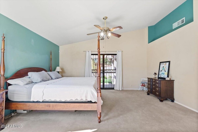 bedroom featuring light colored carpet, vaulted ceiling, and ceiling fan